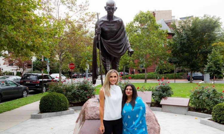 President Donald J. Trump sent his daughter-in-law Lara Trump as his representative to offer respects at the Gandhi Memorial in Washington DC in advance of the 150th Birth Anniversary of Mahatma Gandhi. Accompanying Mrs. Trump to offer respects was Ms. Srilekha Reddy Palle, Board of Directors member of the American Hindu Coalition. They offered flowers at the feet of the statue, seen as a sign of reverence in Hindu tradition.